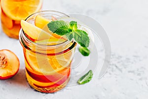 Cold peach and lemon iced tea. Summer refreshing drink