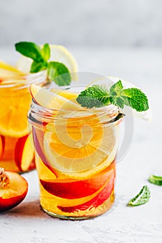 Cold peach and lemon iced tea. Summer refreshing drink