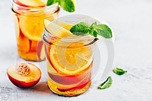 Cold peach and lemon iced tea. Summer refreshing drink