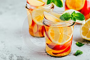 Cold peach and lemon iced tea. Summer refreshing drink