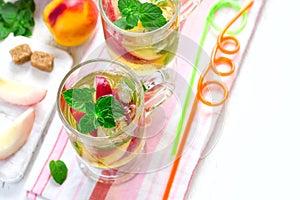 Cold peach tea with mint. Refreshing summer drink. Top view with