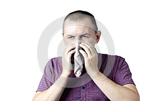 A cold person sneezes into a scarf infected with an infection, an allergy
