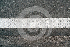 Cold plastic structured stripes with dot pattern for road surface marking as background