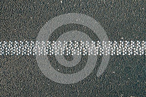 Cold plastic structured stripes with dot pattern for road surface marking as background