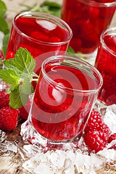 Cold Raspberry drink with mint and ice, selective focus