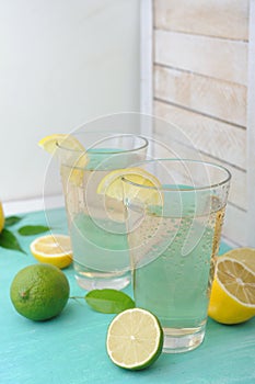 Cold refreshing drink from tasty fresh lemon slice