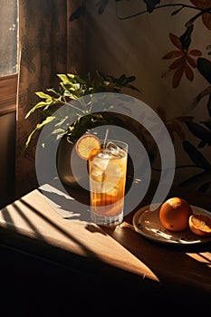 Cold and refreshing orange punch cocktail in a glass with fruit slice. Summer citrus drink