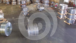Cold rolled steel coil at storage area. Industry plant warehouse with machinery