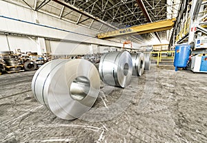 Cold rolled steel coils in storage area ready to feed to machine