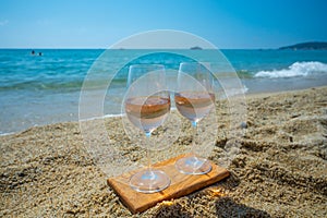 Cold rose wine from Provence served outdoor on white sandy beach Plage de Pampelonne near Saint-Tropez, France