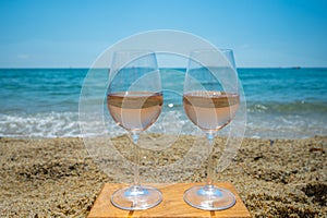 Cold rose wine from Provence served outdoor on white sandy beach Plage de Pampelonne near Saint-Tropez, France