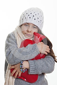 Cold sick ill child with hot water bottle.