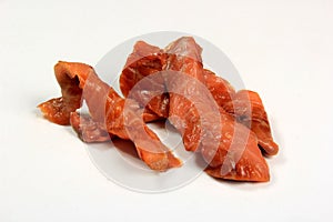 Cold smoked salmon strips on a white background