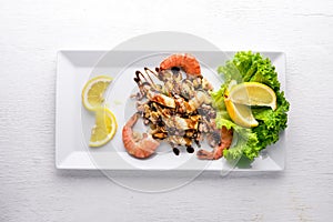 Cold snacks. Seafood, shrimp,On a wooden background.