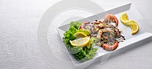 Cold snacks. Seafood, shrimp, On a wooden background. Top view. Free space