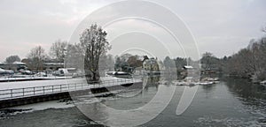 A cold snow covered winters day at the river Ouse at St Neots Cambridgeshire