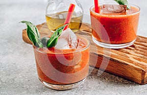 Cold Spanish tomato soup Gazpacho served with ice in glasses. Summer food concept