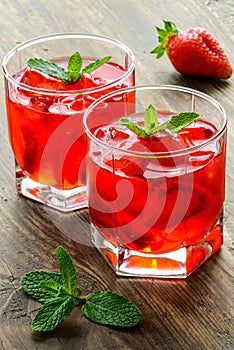 Cold strawberries drinks with strawberry slices