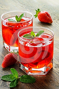 Cold strawberries drinks with strawberry slices