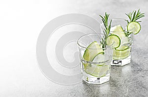 Cold summer beverage Fresh drink cucumber ice rosemary herb