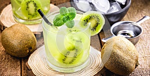 Cold summer drinks  Kiwi Lime  Mojito or caipirinha drink recipes  alcoholic cocktail  lemon or mint and fresh kiwis