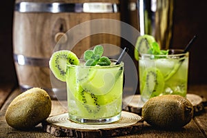 Cold summer drinks  Kiwi Lime  Mojito or caipirinha drink recipes  alcoholic cocktail  lemon or mint and fresh kiwis