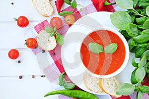 Cold summer tomato dish. Gaspacho soup with toast.