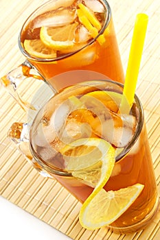 Cold tea with cubes of an ice and a lemon