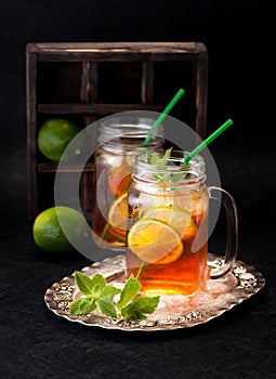 Cold tea with lime and fresh mint. rustic style
