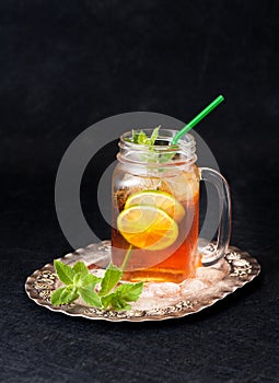 Cold tea with lime and mint. rustic style