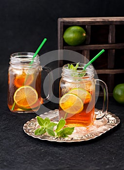 Cold tea with lime and mint. rustic style