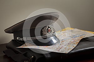 Cold War officer cap on brief case