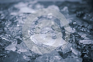 Cold water and ice cubes melting background. Global warming or climate change concept