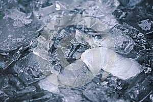 Cold water and ice cubes melting background. Global warming or climate change concept