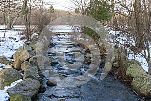 Cold water streaming from frozen pond at Borderland State Park photo