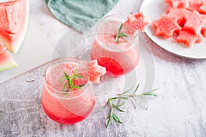 Cold watermelon drink in glasses on the table. Summer refreshing cocktails