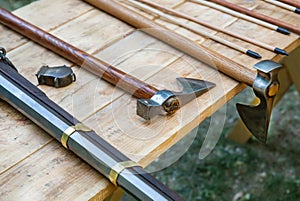 Cold weapons and firearms ax and musket close-up, assorted weapons and arrow