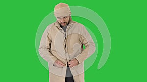 Cold weather Autumn or winter day Man in trench buttons up on a Green Screen, Chroma Key.