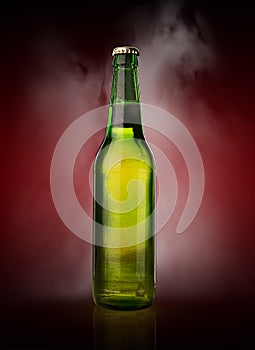 Cold wet beer bottle with frost and vapor