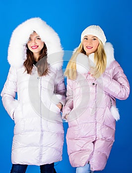 Cold winter conditions. happy winter holidays. women in padded warm coat. winter clothing fashion. flu and cold. girls