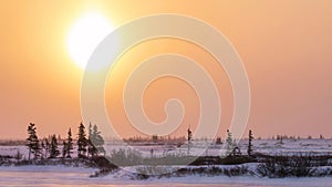 A sun dog sunrise in northern Canada in winter. photo