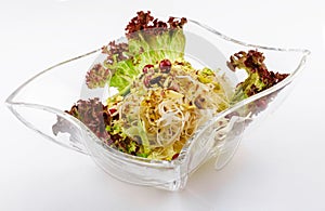 coleslaw with pistachios in a glass bowl