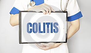 Colitis card in hands of Medical Doctor