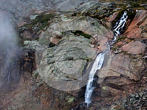 Coliumbine Falls spills into Peacock Pool 150 feet below from Chasm Lake