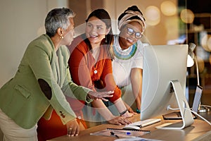 Collaboration, communication and a business woman with her team, working on a computer in the office at night. Teamwork