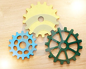 Collaboration, engineering and construction concept with industrial gears, mechanics and cogs on a table or desk in an