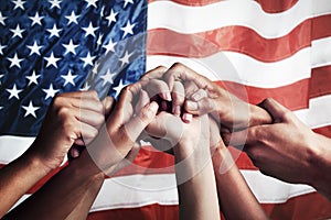 Collaboration, unity and hands holding on American flag for community together in teamwork for the country. Group