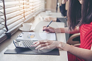 Collaboration worker in office working together with Excel graph with Spreadsheet Document showing Information Financial Startup