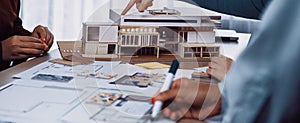 Collaborative Architecture Design Session with Scale Model and Blueprints on Table SACTR