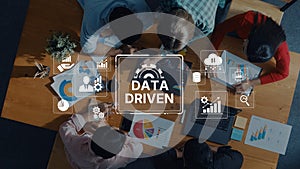 Collaborative Work Environment Focused on Data-Driven Decision Making with Diverse Team Analyzing Charts and Graphs from